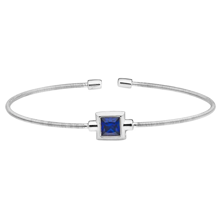 Wooden bracelets for rustic charm-Rhodium Finish Sterling Silver Cable Cuff Bracelet with Princess Cut Simulated Sapphire Birth Gem