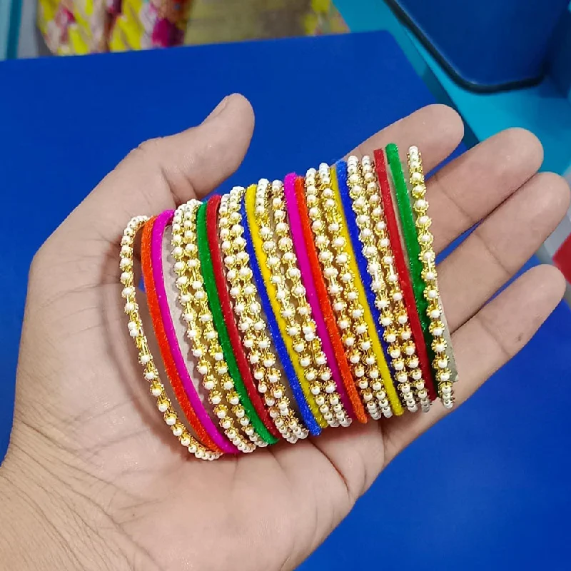 Simple silver bangles for minimalist chic-Pooja Bangles Gold Plated Velvet And Pearls Bangles Set